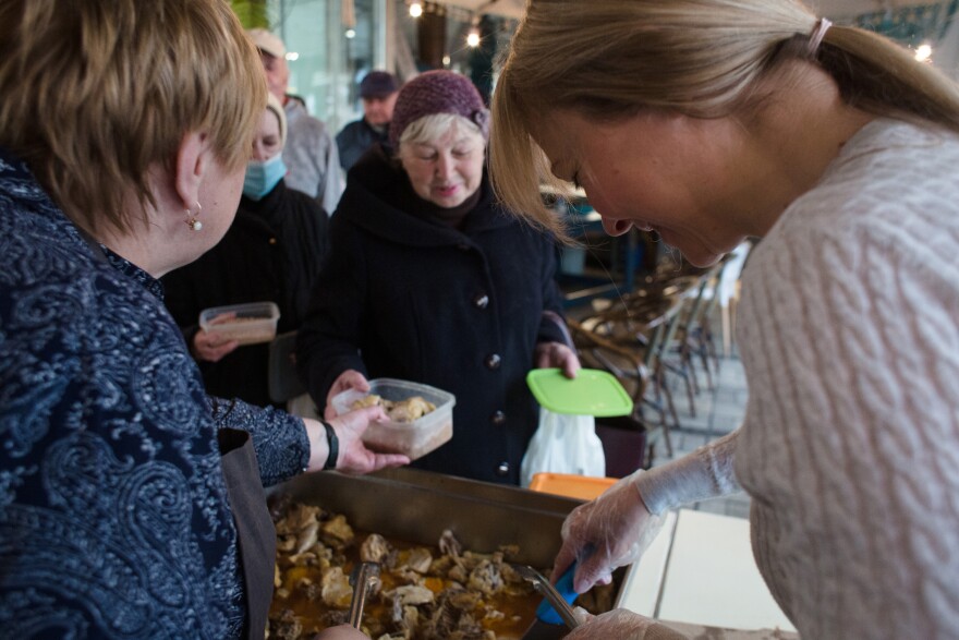 <strong>March 29:</strong> The volunteers of 'Palianytsia' café serve meals to visitors in Kyiv. The café provides free meals for the elderly.