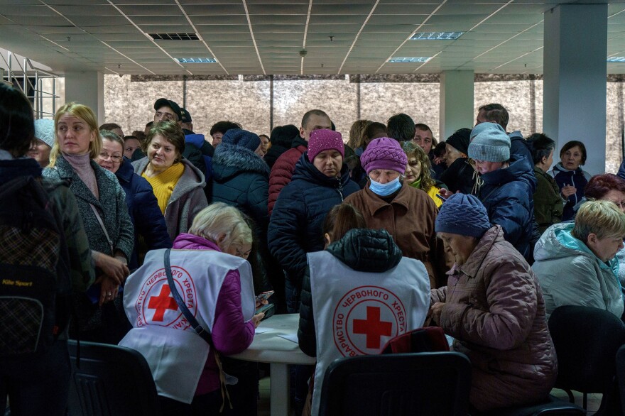 <strong>March 30:</strong> Volunteers help recipients in a Red Cross and local NGO's registration center for Internally Displaced People in Zaporizhzhia. The center helps people who managed to escape the war in eastern Ukraine with money, food and other supplies.