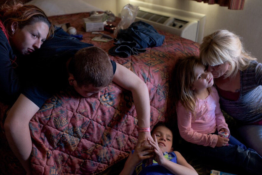 Vinny, now 16, and his girlfriend (left) visit his younger siblings and mom. "I feel happy when I'm with my mom, little siblings and my older brother. I make the best of what I have," says Vinny.
