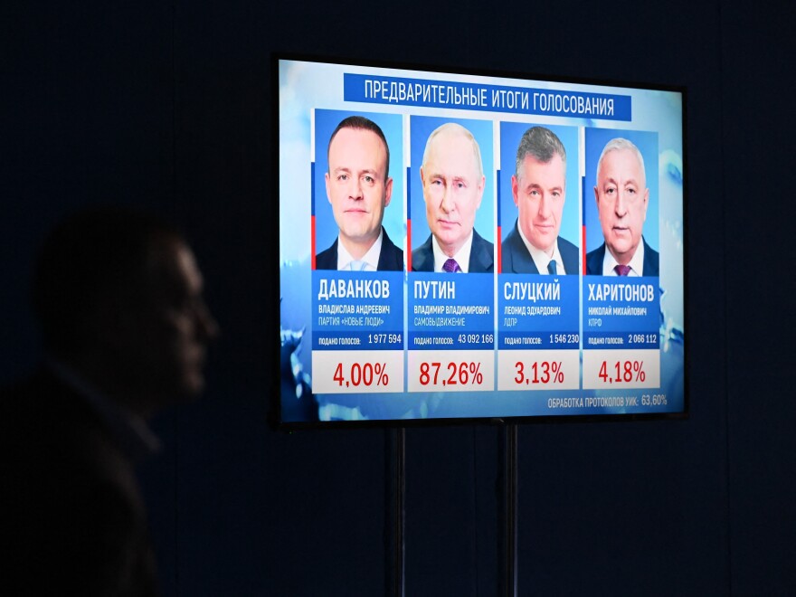 Preliminary results of the presidential election are displayed on a screen at the campaign headquarters of Russian President and presidential candidate Vladimir Putin in Moscow on March 17, 2024.