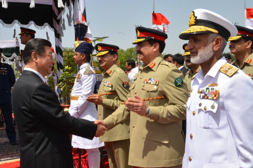 China's President Xi Jinping (left) greets Pakistan's army chief Gen. Raheel Sharif in Islamabad, Pakistan, on April 20. During Xi's visit, the two sides launched an ambitious $46 billion economic corridor linking Pakistan's port of Gwadar with western China.