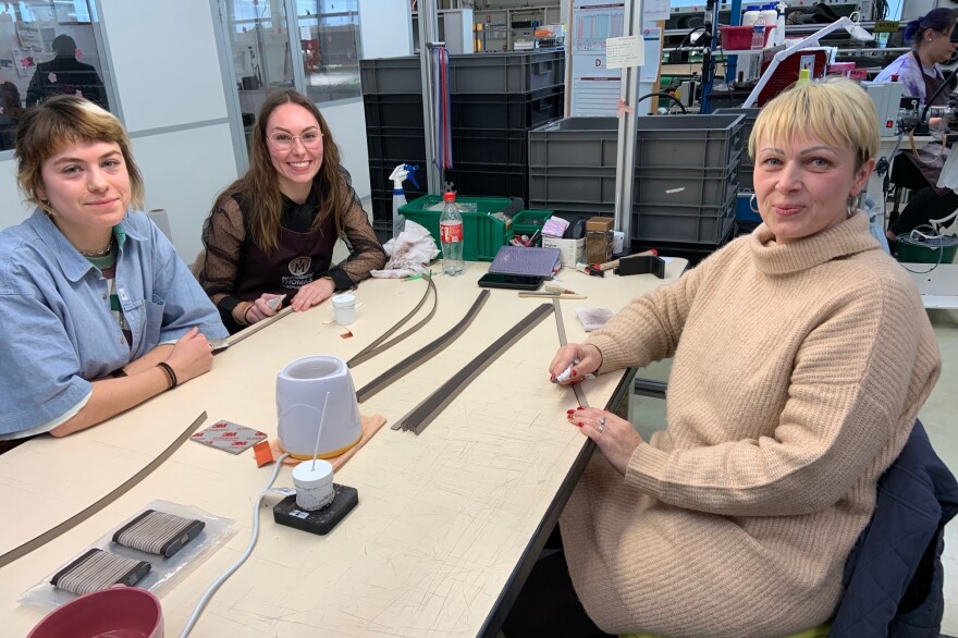 The factory is "a wonderful place to work," says Oksana Zoubko (right), sitting with her colleagues Ines Chapovaloff (center) and Maud Duvignacq (left). "A very wholesome atmosphere and our French colleagues are welcoming."