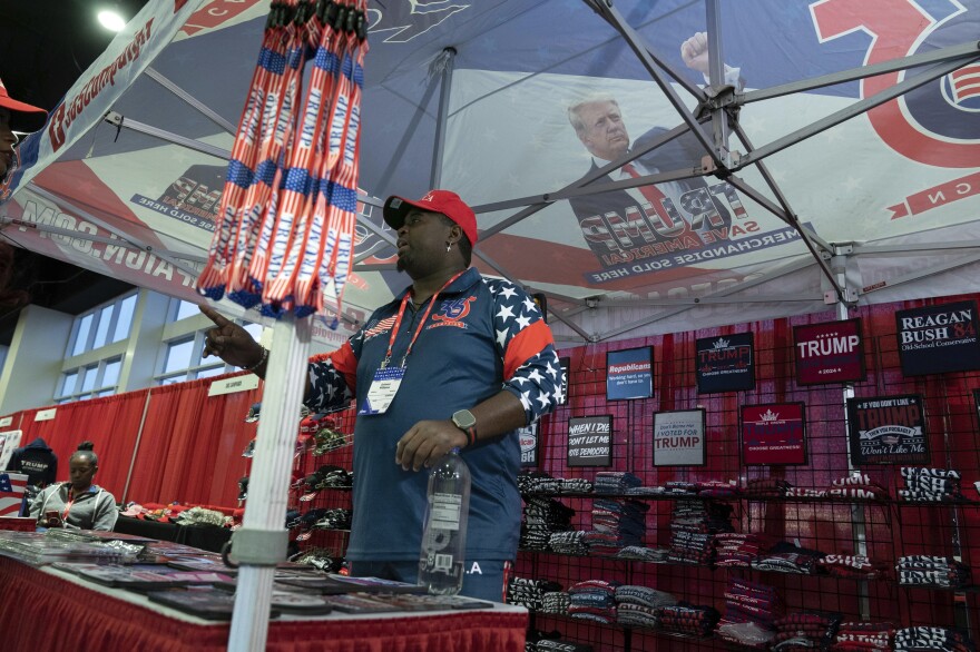 A booth selling hats and T-shirts is seen during the Conservative Political Action Conference, CPAC 2023, cheers during the session, at the National Harbor, in Oxon Hill, Md., Thursday, March 2, 2023.