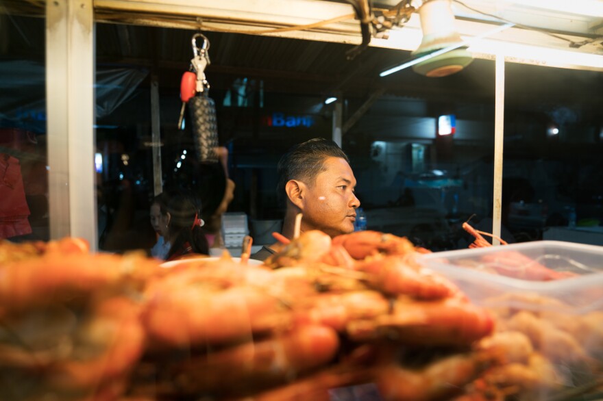 Engkas Kosasih prepares popiah, a spring-roll like dish from from Medan. They come either deep-fried or steamed.