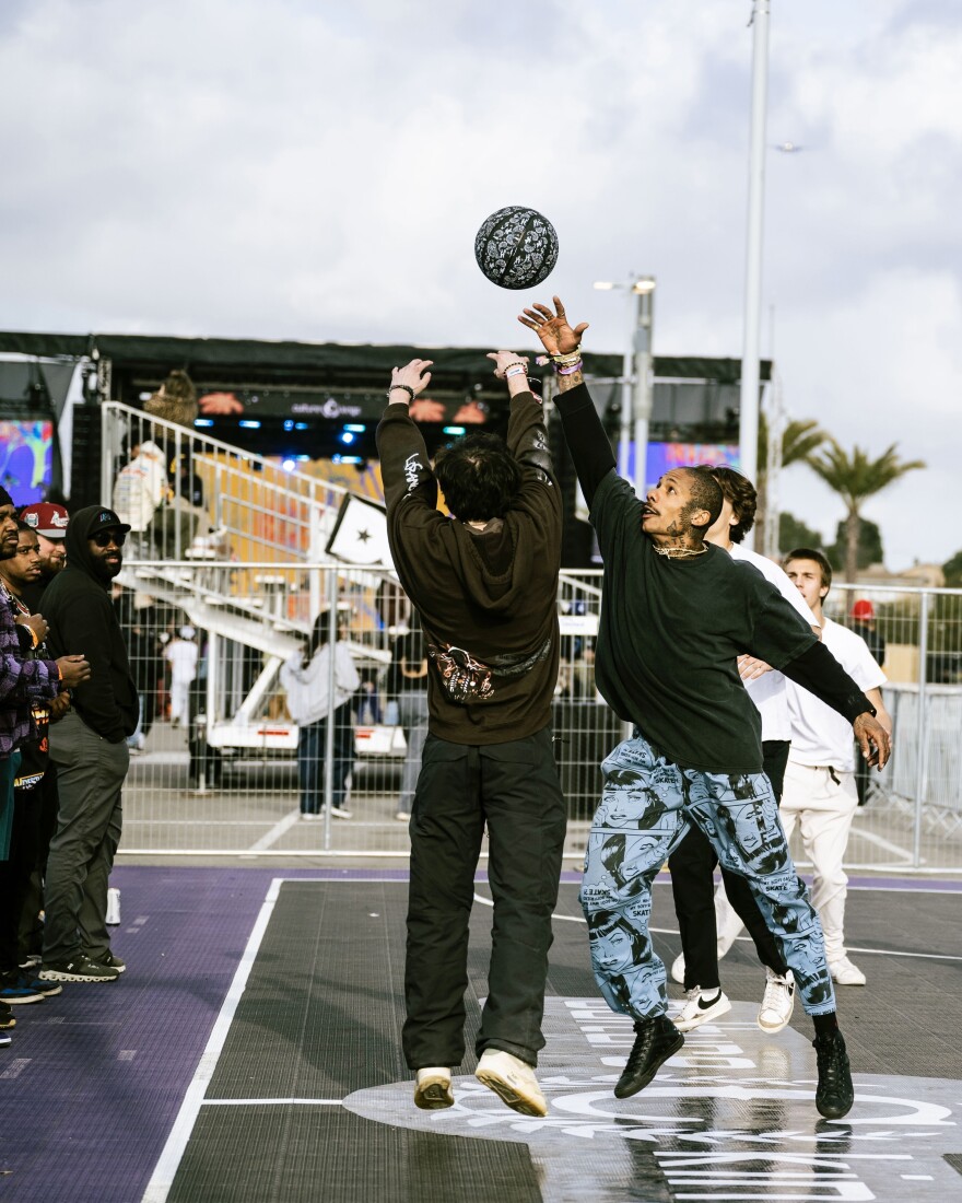 Festivalgoers playing a game of pick-up at the Rolling Loud basketball court.