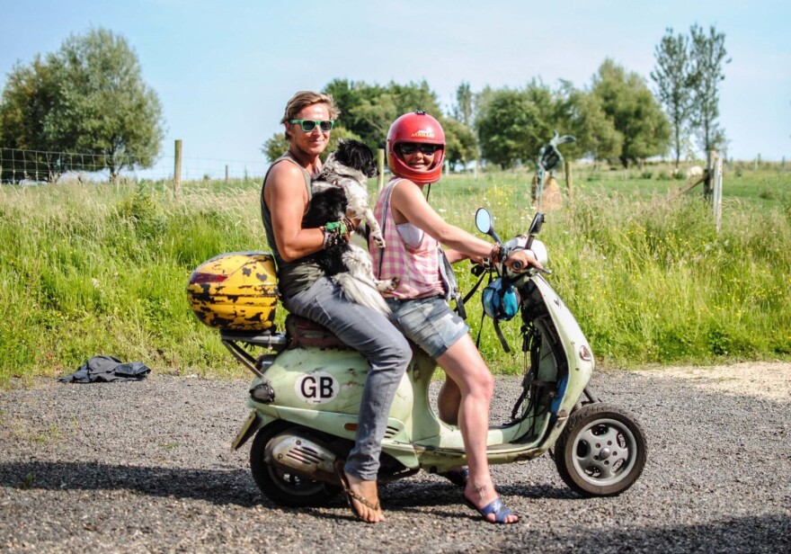 Tommy and Emma Trenchard are siblings who share an unusual ability to pick up all kinds of objects with their toes. Joining them in the photo, taken in England where they grew up, is Emma's dog.