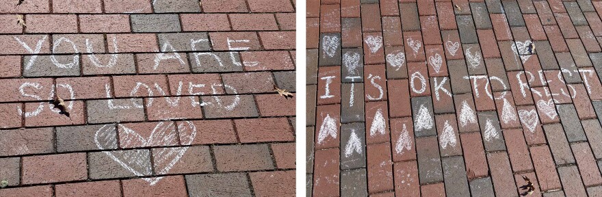 UNC students wrote messages in chalk outside the student union reminding peers "It's ok if you don't feel 100%," "it's OK to rest" and "you are so loved."