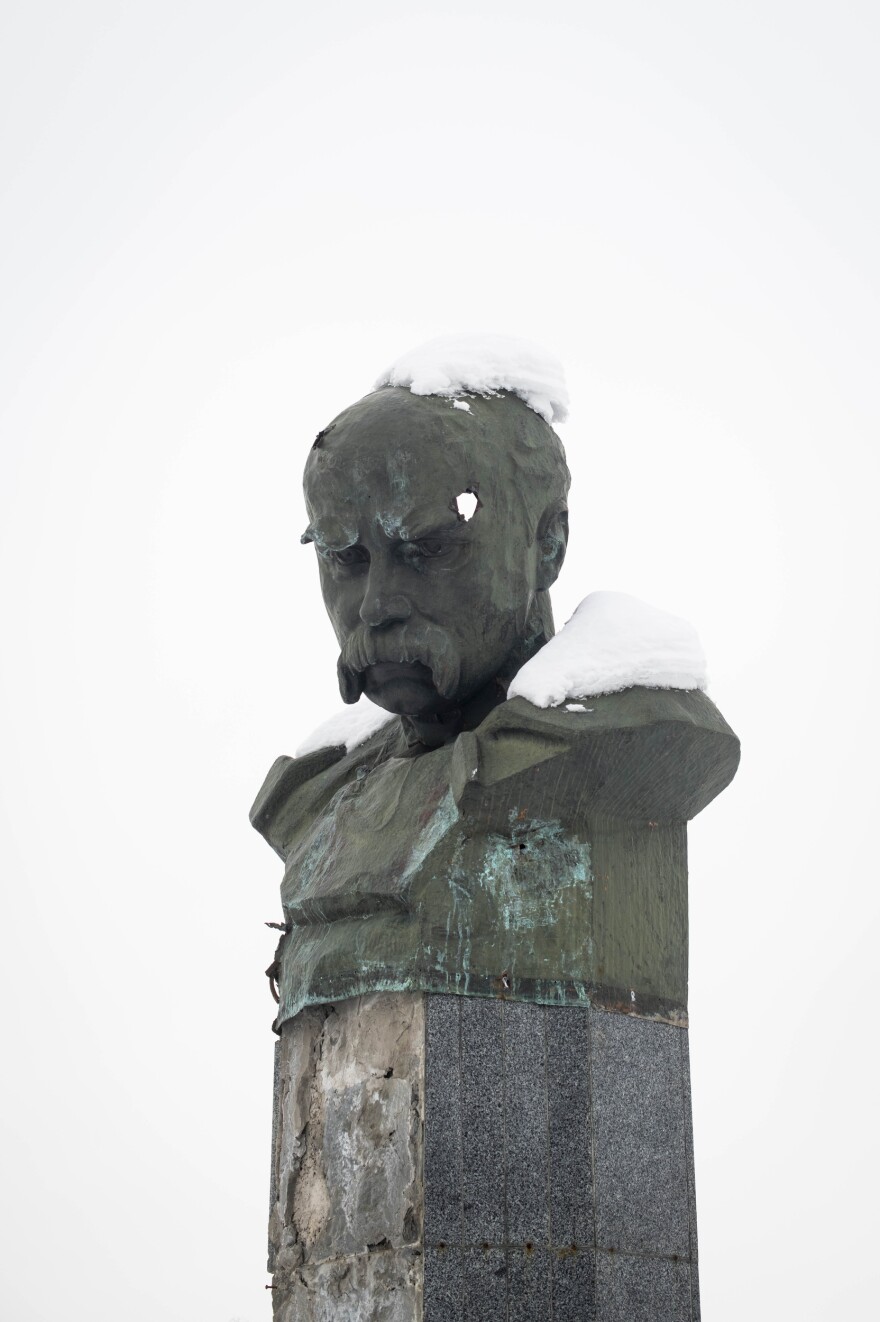 A bust of Taras Shevchenko, a 19th-century Ukrainian poet and national icon. Residents say that the holes in the bust appeared during the Russian occupation, apparently from gunshots.