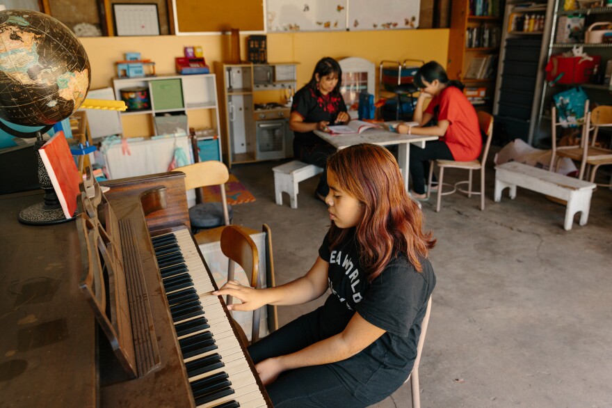 The Escudero family in their garage. Martha Escudero converted the home's garage into a homeschool for her own and other families' children during the pandemic.