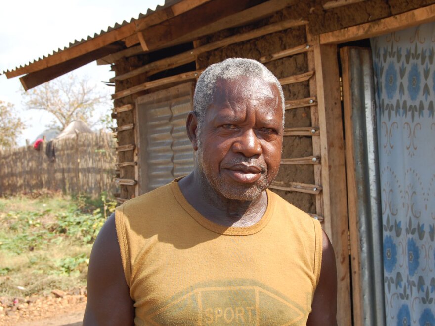 Sabit Abdullah Batali came to Juba, the capital of Southern Sudan, from Khartoum a few years ago and has barely worked since. He stands in front of the mud and wood home he built himself.