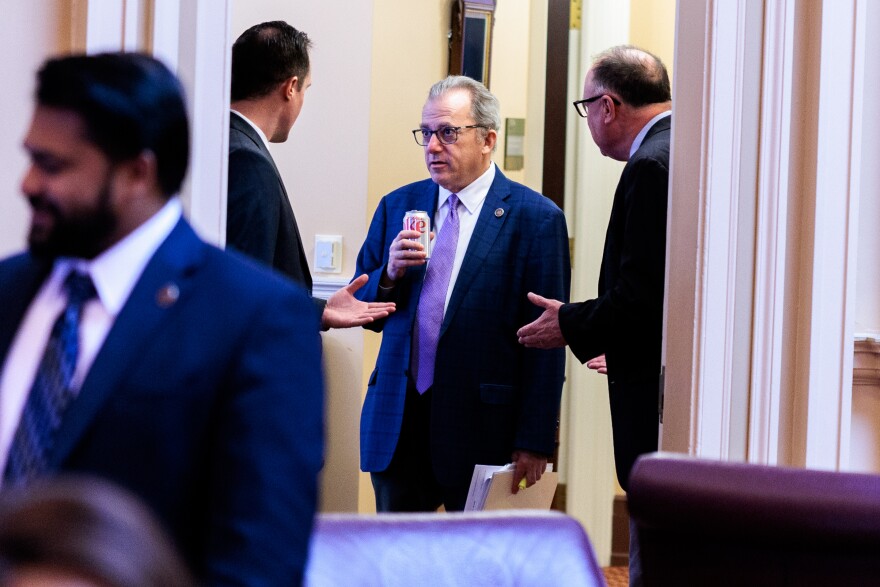 Senators chat after a caucus meeting