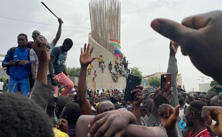 Supporters of the Nigerien defence and security forces gather during a demonstration outside the national assembly in Niamey on July 27, 2023. The head of Niger's armed forces on July 27, 2023 said he endorsed a declaration by troops who overnight announced they had taken power after detaining the country's elected president, Mohamed Bazoum.