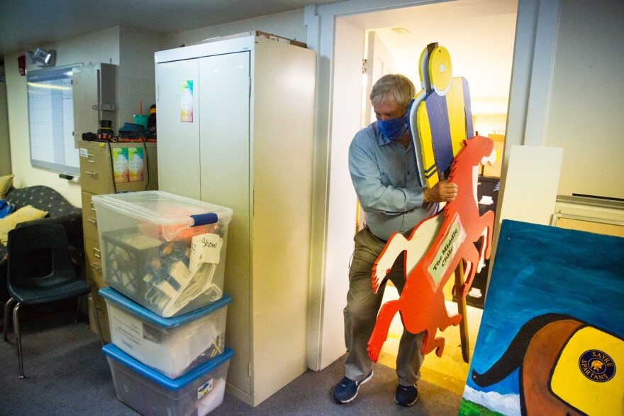 Steve Guynn, Sayre School's director of buildings and grounds, helps move materials for the school's upcoming horse show.