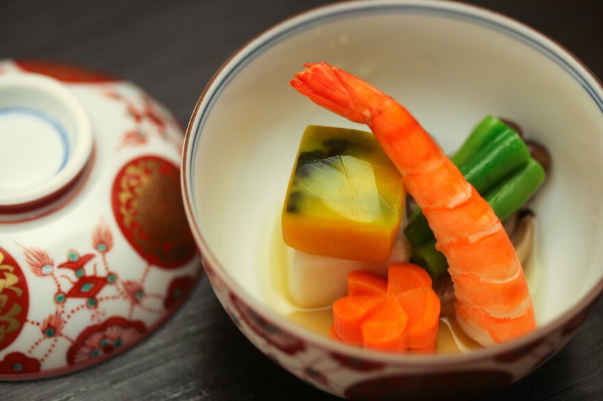 Even the dishware carries meaning. For a demonstration, executive chef Ryo Iizawa of the Embassy of Japan chose red and white dishware because "it's very Japanese" — red is symbolic of Japan, he explains, while white is a color for celebrations.