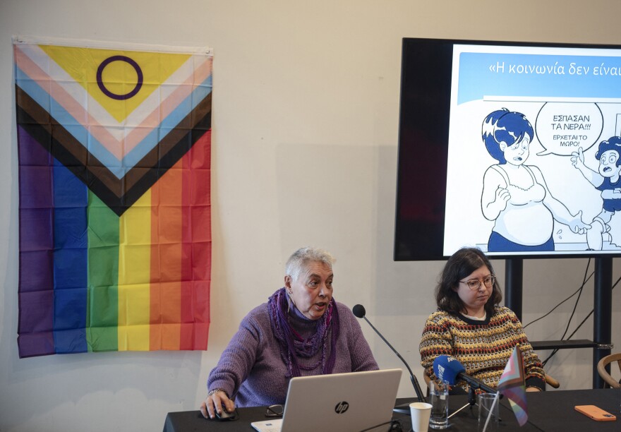 Stella Belia (left), a member of the Rainbow Families of Greece organization for LGBTQ parents, speaks during a press conference at the Onassis Cultural Center in Athens, on Jan. 30.