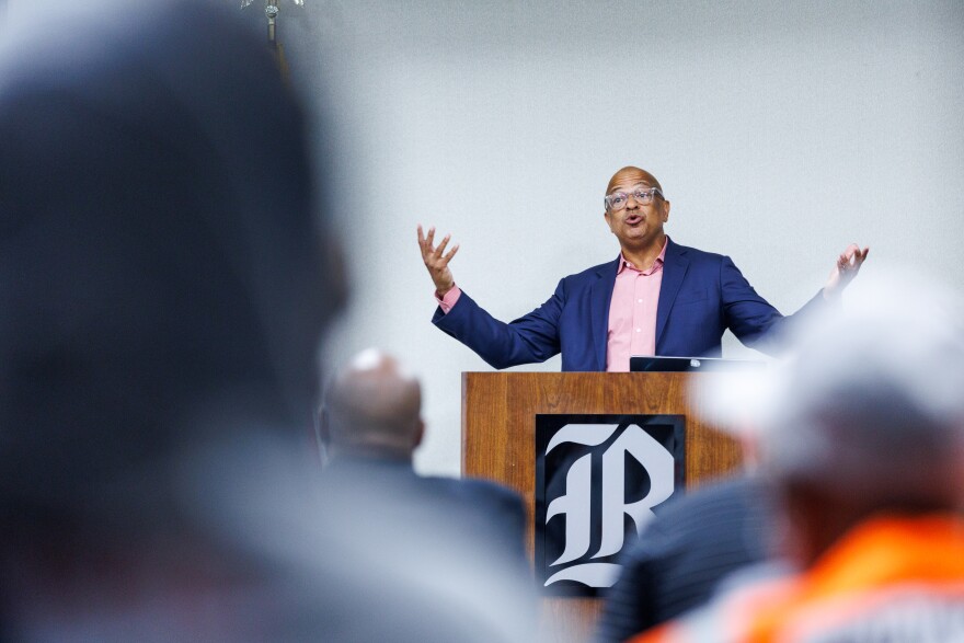 Liggins speaks at a podium