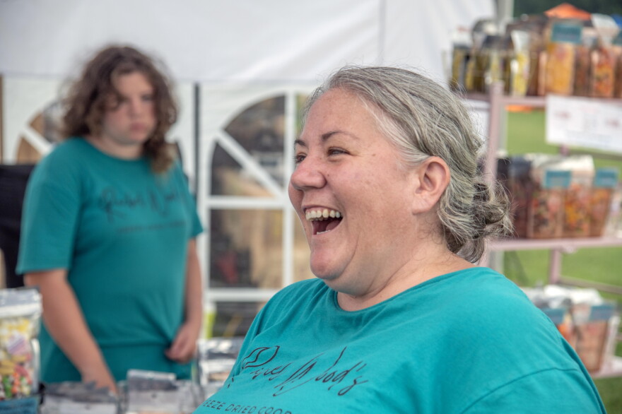 Rachel Wood, of Rachel Wood's Freeze Dried Goods, laughs on Friday, July 10, 2026, at the Hanover Tomato Festival in Hanover County, Virginia.