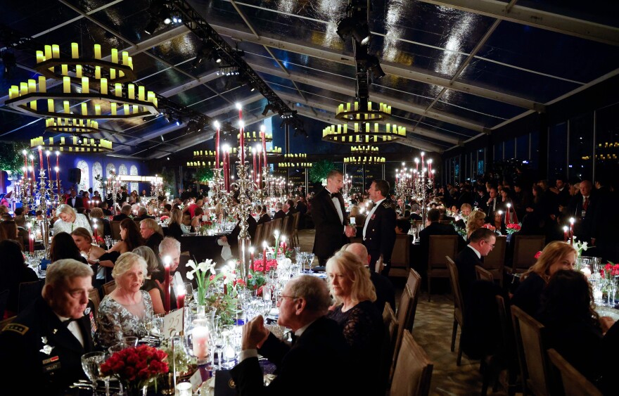 Chairman of the Join Chiefs of Staff General Mark A. Milley and others attend a state dinner for French President Emmanuel Macron on the South Lawn of the White House on Thursday in Washington, DC.