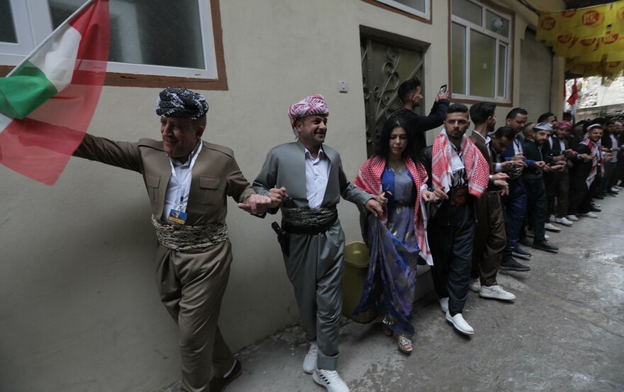Iraqi Kurds celebrate the Persian New Year, Nowruz, in the town of Akra in Iraq's northern autonomous Kurdish region, on March 20, 2023.