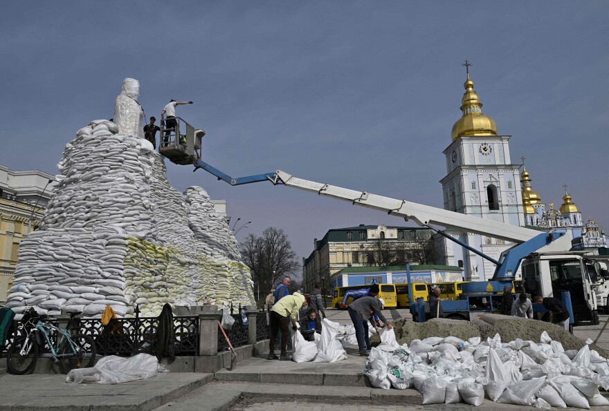 <strong>March 31:</strong> Volunteers assemble sand bags to cover and protect the Monument to Princess Olga, St. Andrew the Apostle and the educators Cyril and Methodius in Kyiv, amid Russian invasion of Ukraine.