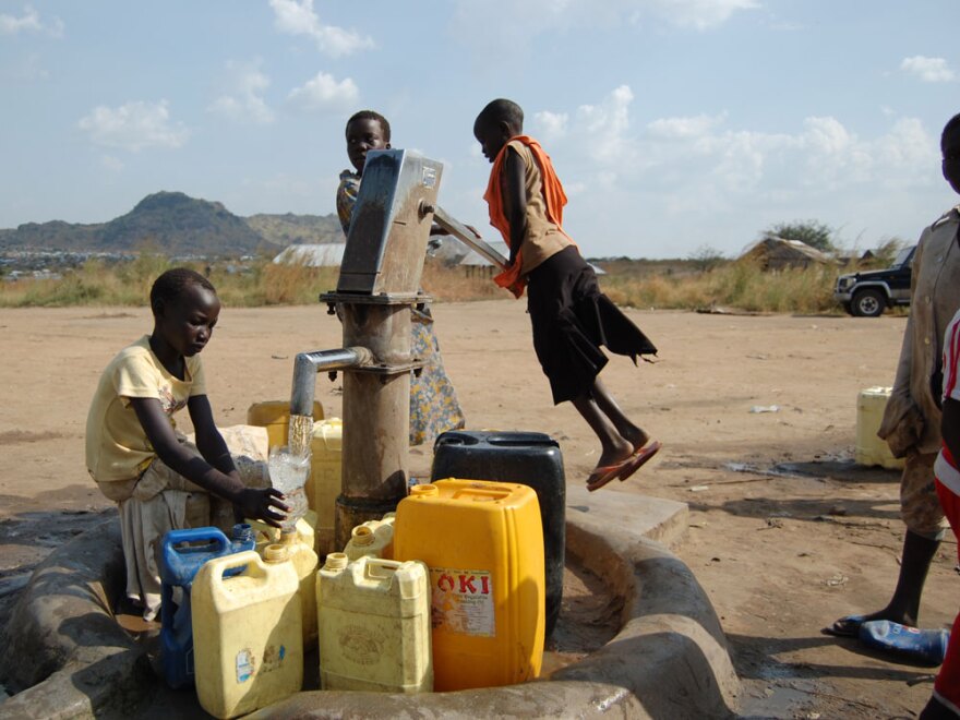 Many residents of Gudele West must walk more than half a mile to get water.