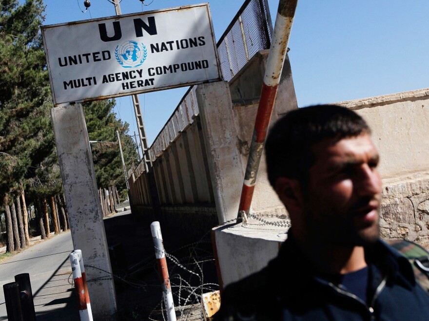 A security guard stands outside the United Nations building in Herat a day after the Oct. 24 attack on the compound by suicide bombers.