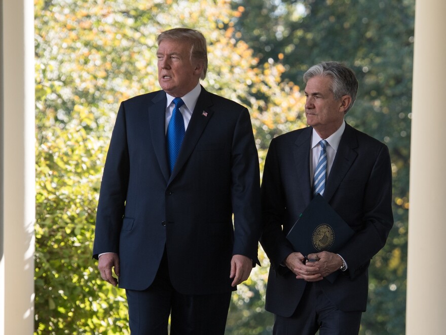Then-President Donald Trump walks with Powell after nominating him to head the Federal Reserve on Nov. 2, 2017. Trump broke with recent tradition by picking a new Fed chief.