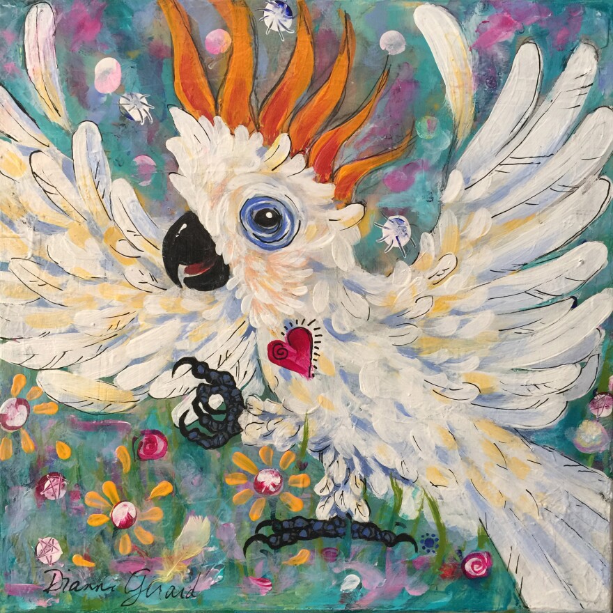 A painting of a white cockatoo with orange feathers on its head against a green background. Wings spread out, and a red heart on its breast.