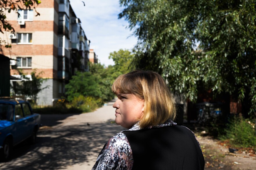 Svitlana Domoratska, a social worker in Sloviansk, walks through the city to visit older, homebound residents.