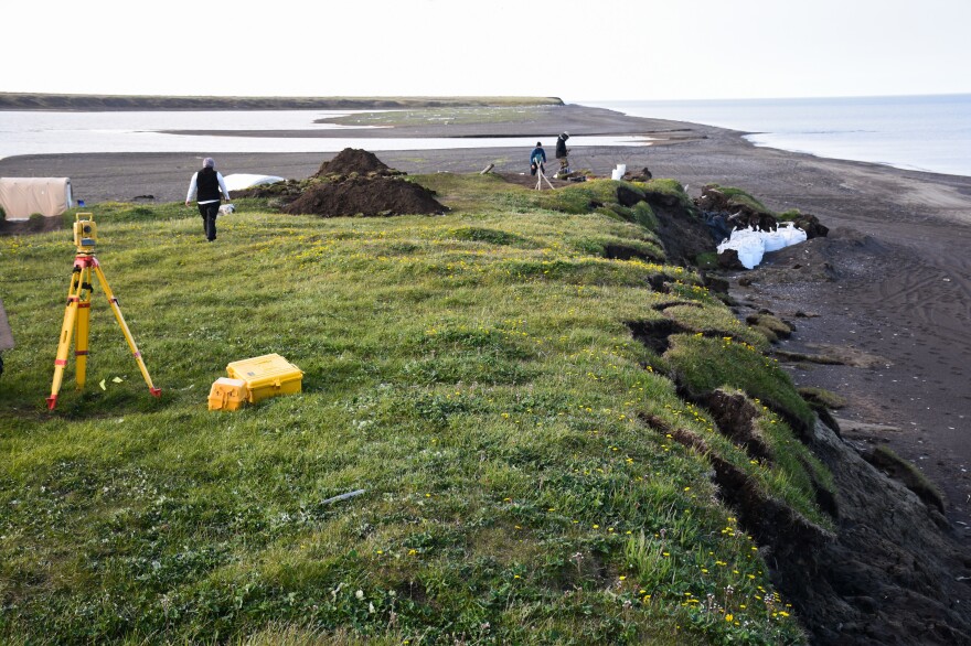 In the past few years, severe storms have ripped off big chunks of the Alaska coastline. The white bags are used to try to prevent the ancient log cabin from sliding into the sea.