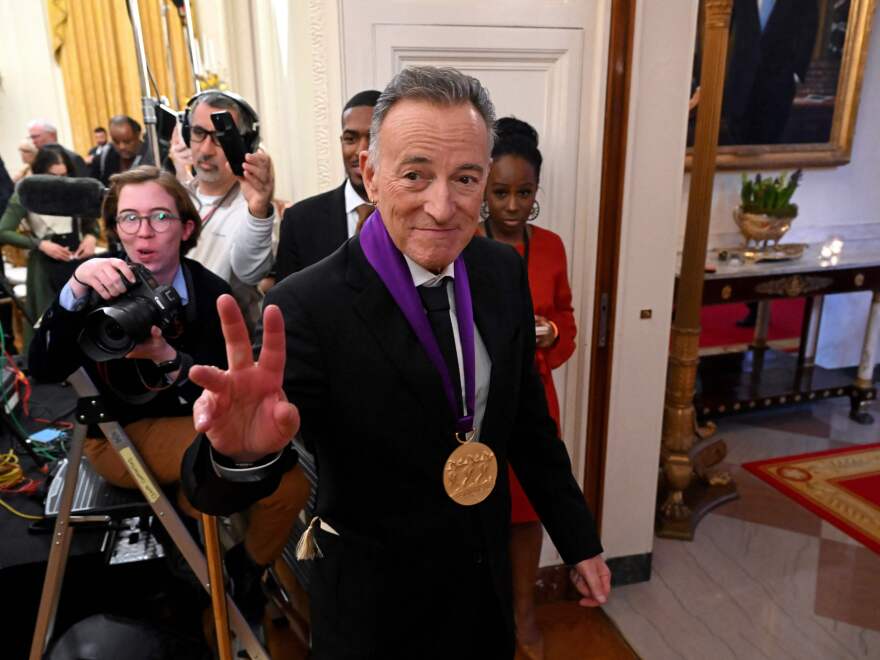 Musician Bruce Springsteen leaves the East Room of the White House after receiving the National Medal of Arts from President Biden.