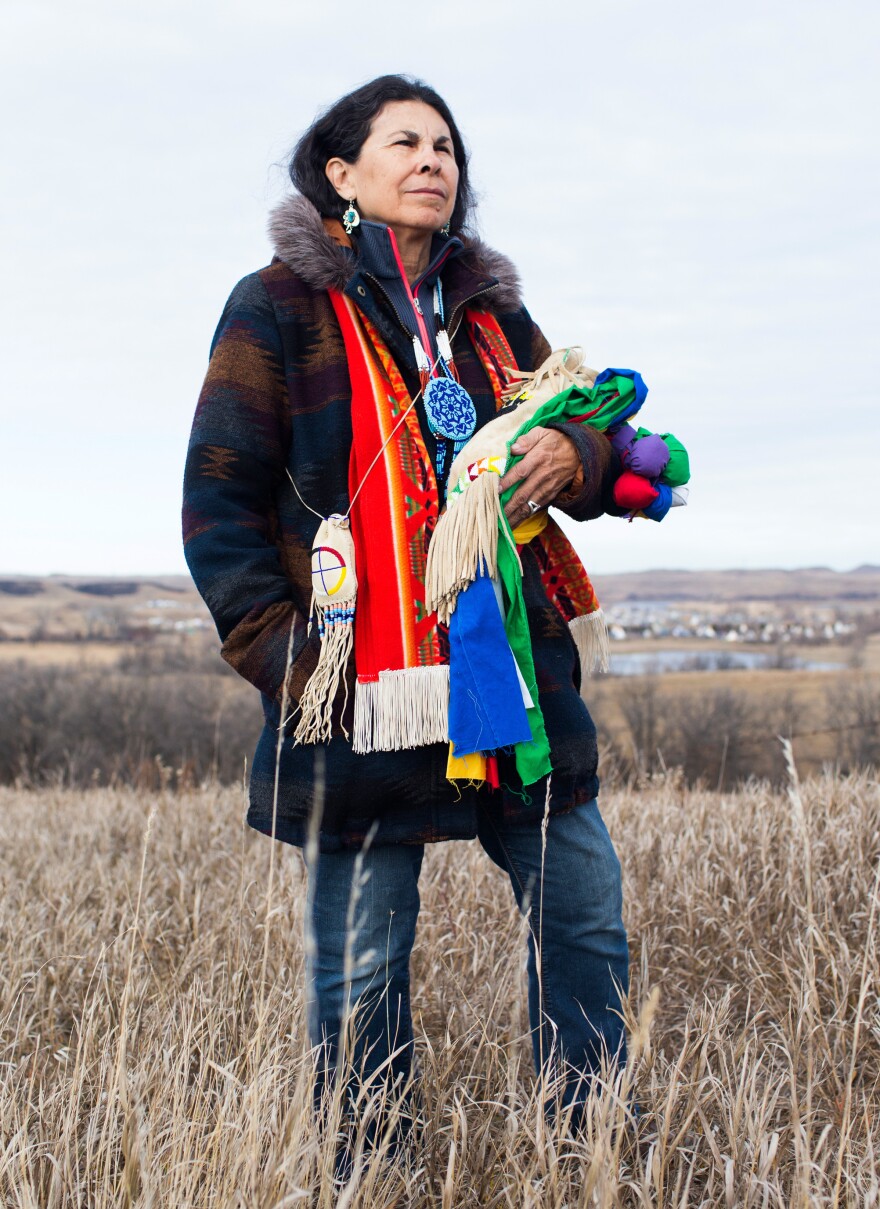 Rachelle Figueroa, 65, holds her pipe bag, which houses her chanupa, a sacred ceremonial pipe.