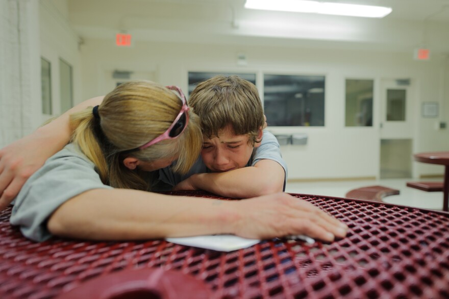 Vinny, at age 13, cries during a visit with his mother, Eve, at the Bernalillo County Juvenile Detention Center in Albuquerque, New Mexico. "Mom, just get me out," he says. Vinny was incarcerated for stabbing his mother's assailant: "When my mom was being beat up, I was so scared. I wanted to defend my mom."