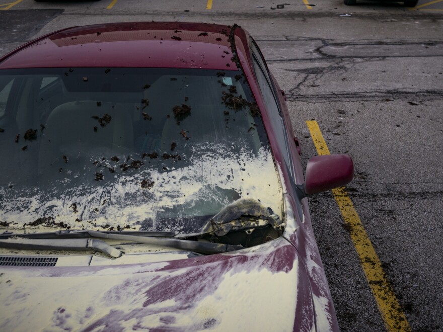 Debris covers the ground and nearby cars after an explosion at the I. Schumann & Co. metals plant on Monday. It still remains unclear what caused the explosion.