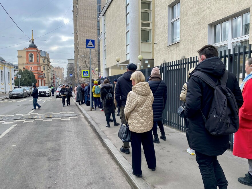 Russian voters outside a voting precinct in central Moscow on Sunday as part of the "Noon Against Putin" protest.