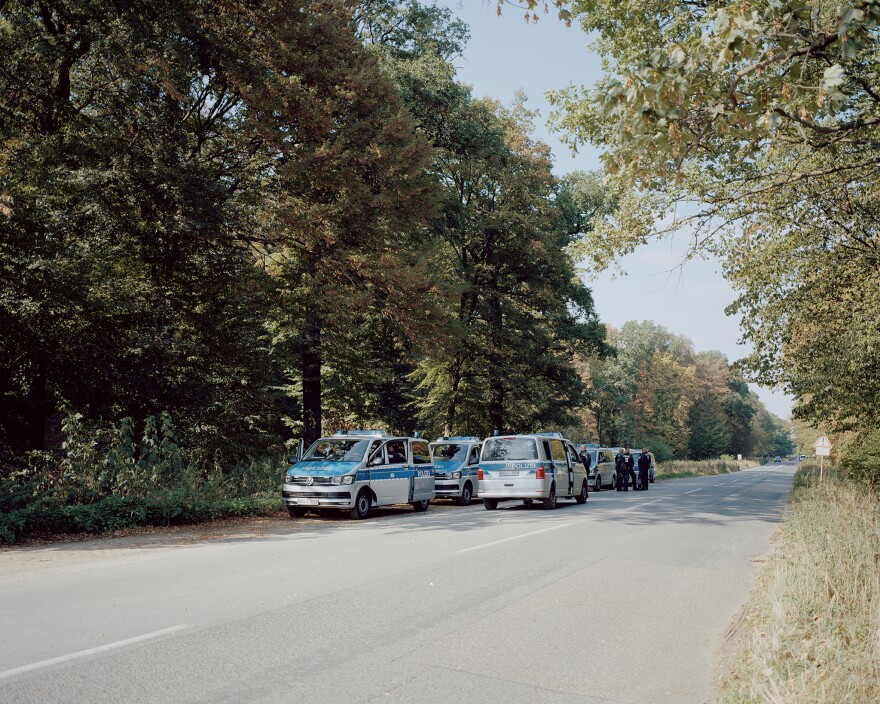 Police cars line up outside Hambach Forest. The eviction of activists began on Sept. 13, 2018. For five days, special forces and police destroyed the treehouses and arrested activists — until a journalist fell from a tree and died, halting the process.
