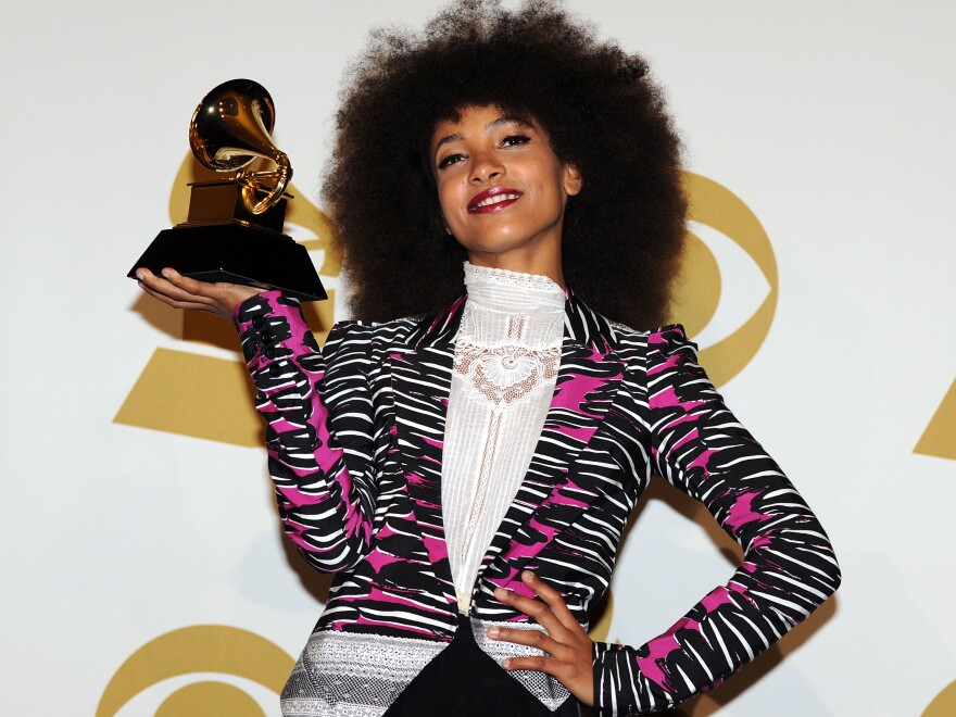 Esperanza Spalding poses with her best new artist trophy during the 53rd annual Grammy Awards in Los Angeles on Feb. 13, 2011.