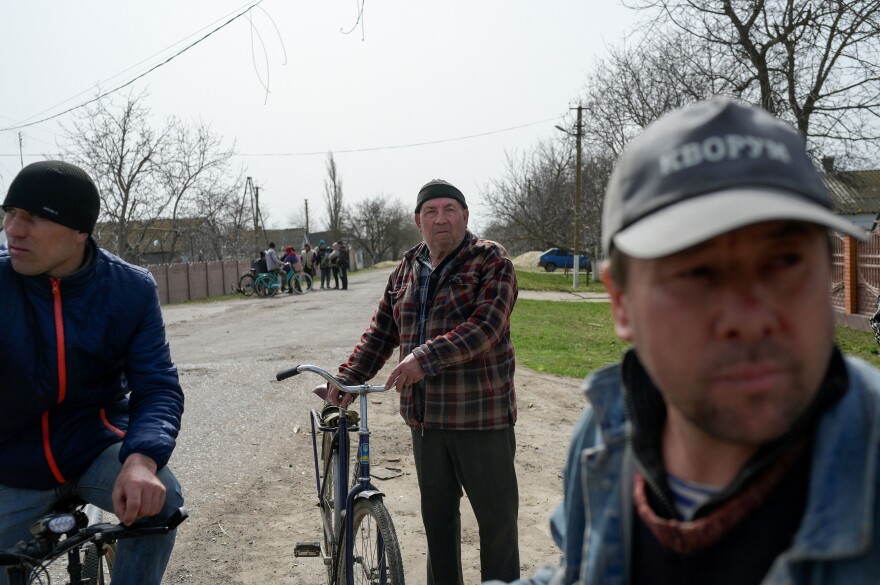 <strong>April 1:</strong> People gather in the deserted southern Ukraine village of Zelenyi Hai between Kherson and Mykolaiv, less than 5km from the front line, as NATO says it is not seeing a pull-back of Russian forces in Ukraine and expects "additional offensive actions", alliance chief warns.
