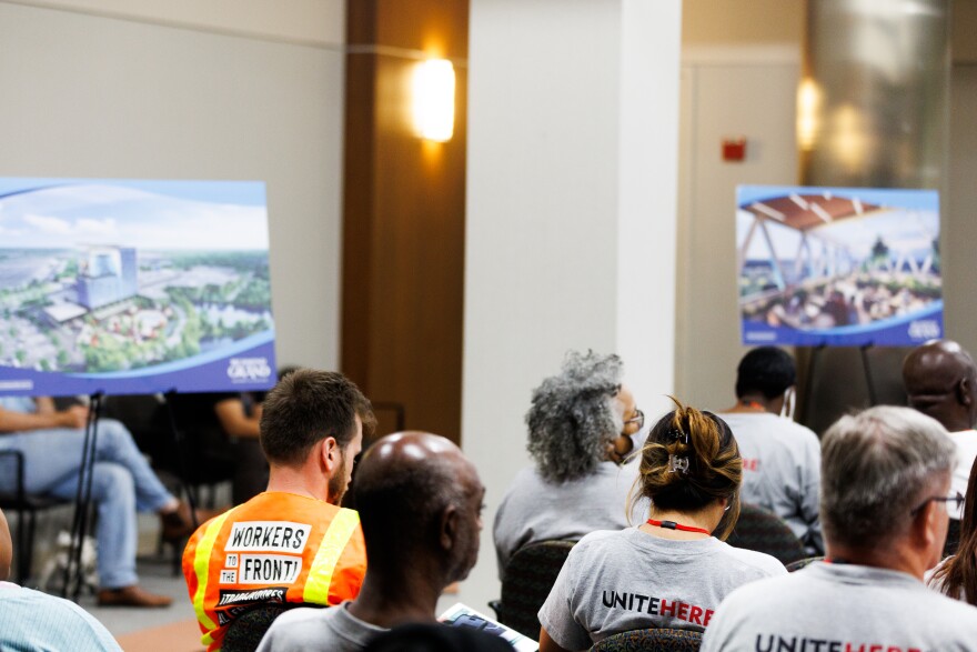 Members of Unite Here listen to a presentation